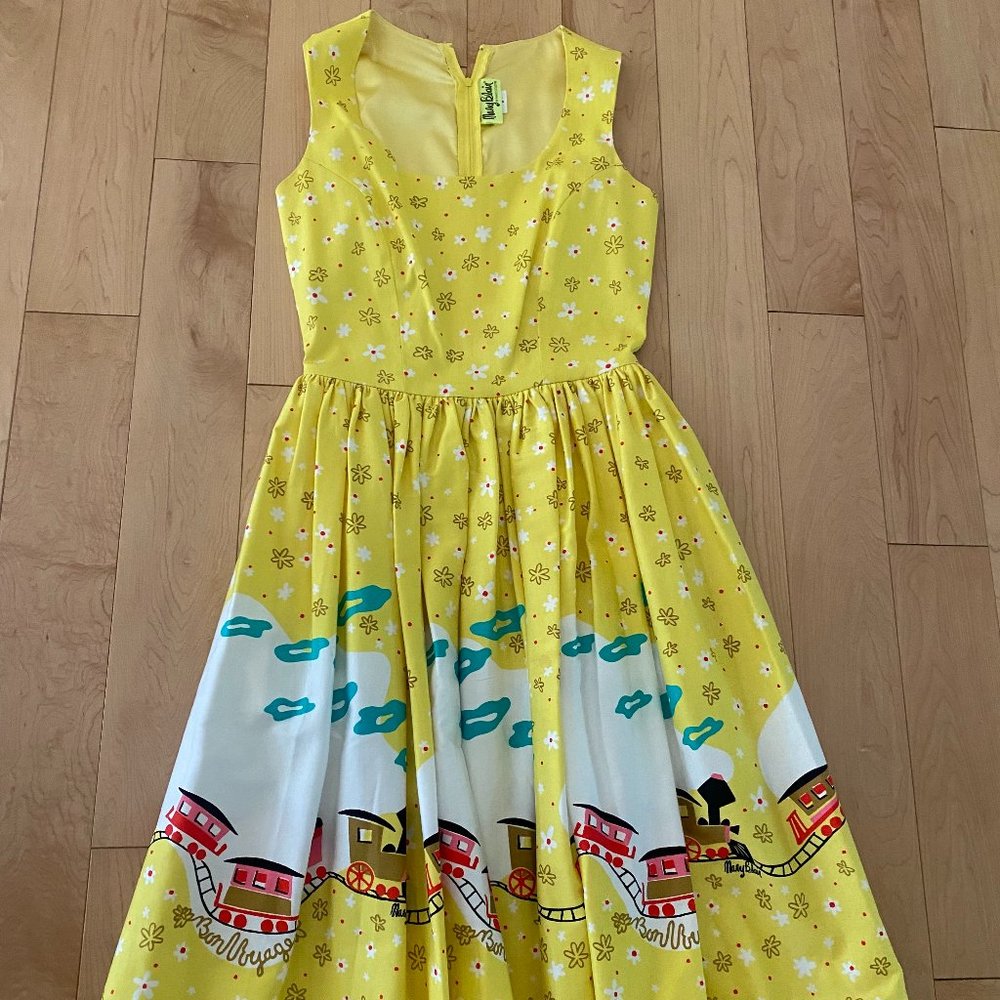 Pinup Girl Clothing Aurora Dress in Mary Blair Yellow Train Print